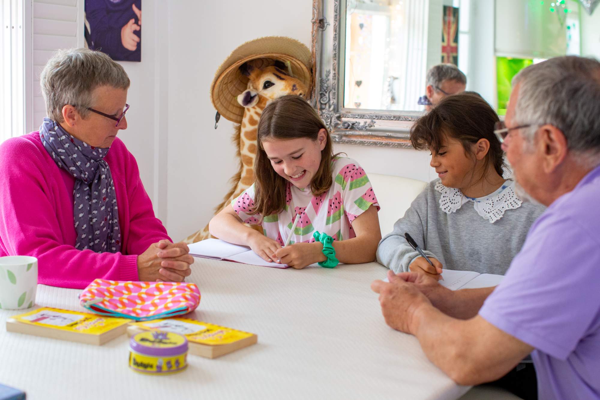 Mum and dad helping daughters with homework